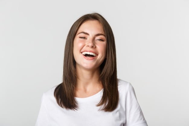 close up happy brunette girl white t shirt laughing smiling carefree camera 1258 19129