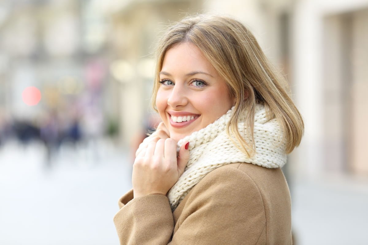 smiling woman on winter street