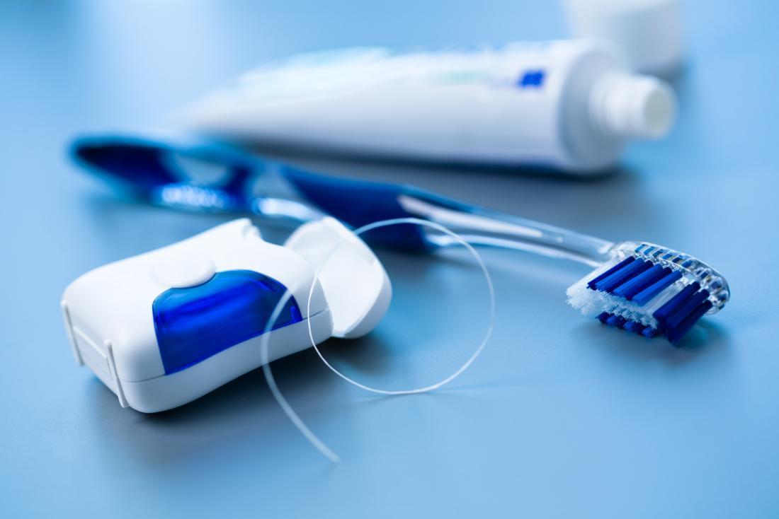 toothbrush toothpaste and dental floss for healthy gums and teeth