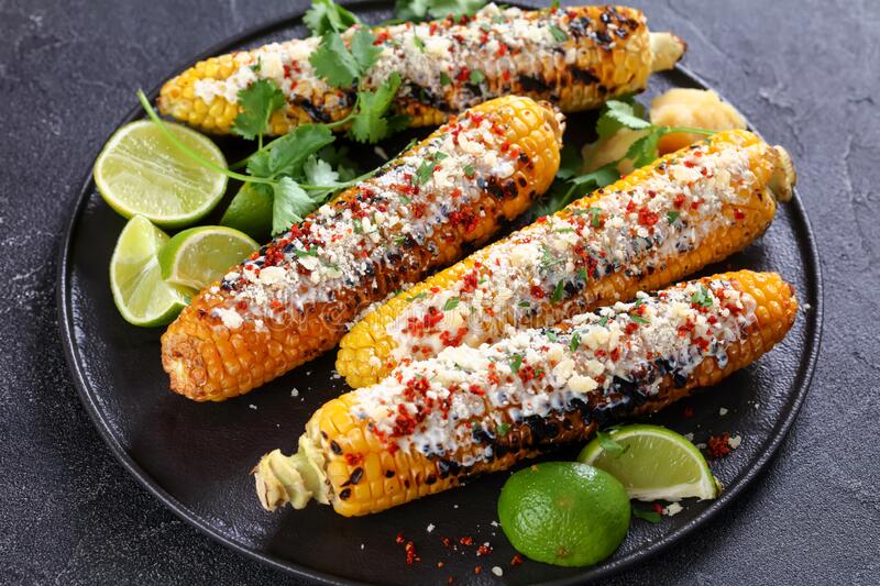 elotes grilled mexican street corn plate elote charred cobs slathered sour cream based sauce seasoned chili 227522098