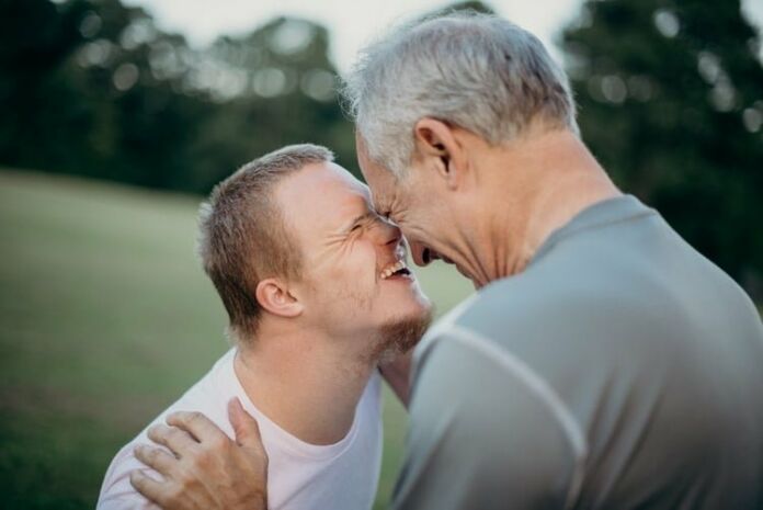 Man and boy with down syndrome - photo by Nathan Anderson
