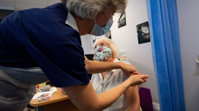 What is the mechanism of action of mRNA vaccines? - Photo by JACOB KING/Getty Images